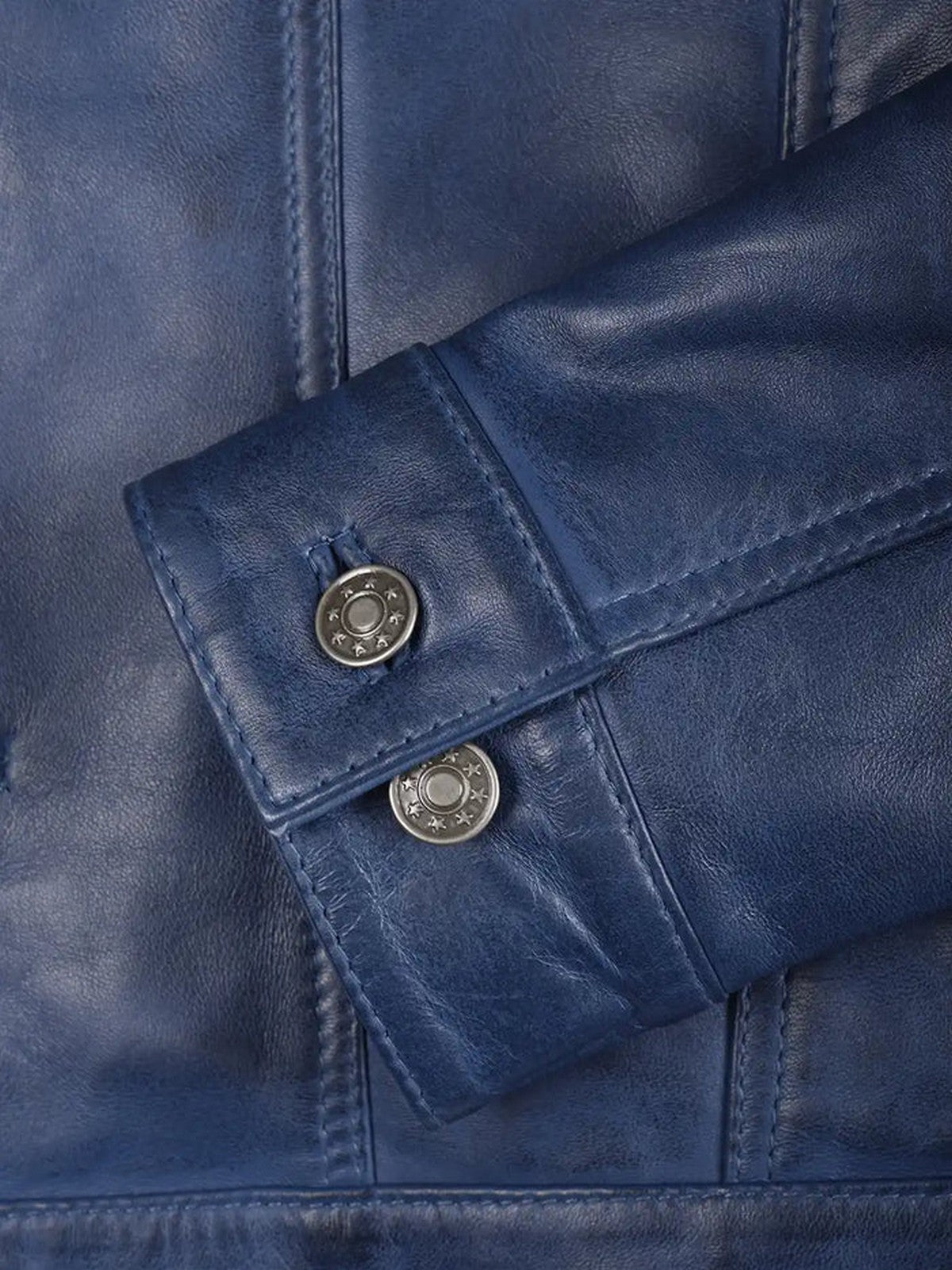 Close-Up of Blue Leather Jacket Button Detailing