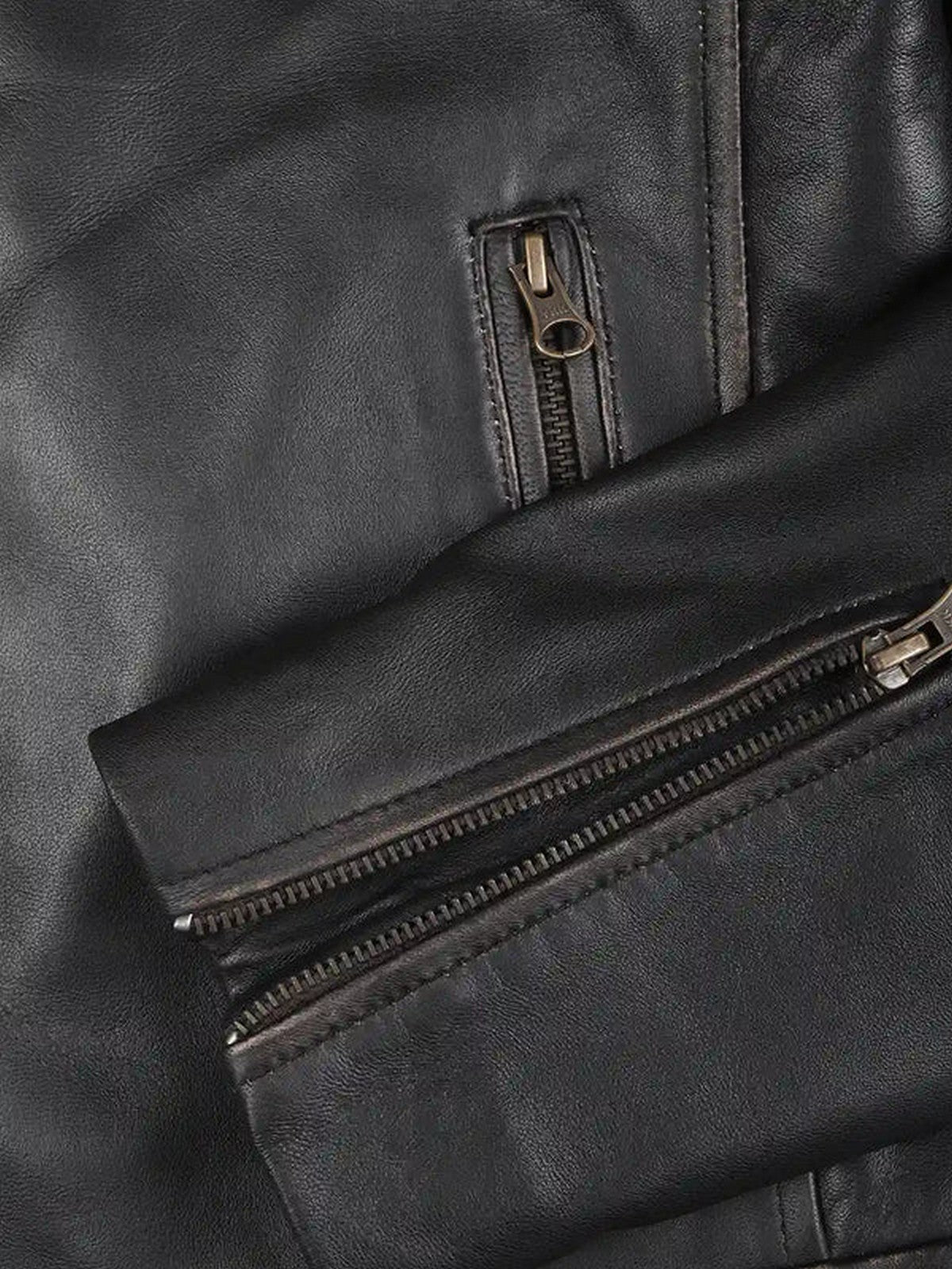 Close-up of zipper and stitching details on men’s dark brown café racer leather jacket by Livra Jackets.