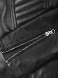 Close-up of zipper detail on women’s biker jacket