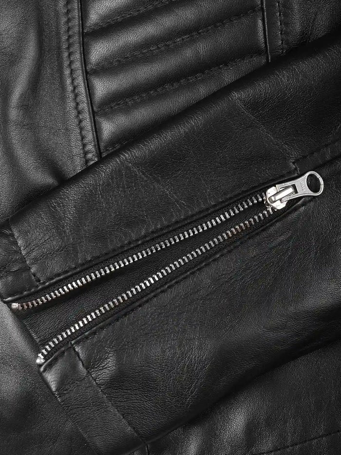 Close-up of zipper detail on women’s biker jacket