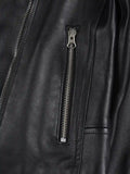 Close-up of zipper pocket on women’s black asymmetrical leather jacket