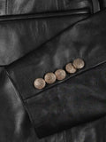 Women’s black leather blazer sleeve detail with golden buttons