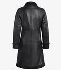 Back view of women’s black shearling long leather coat