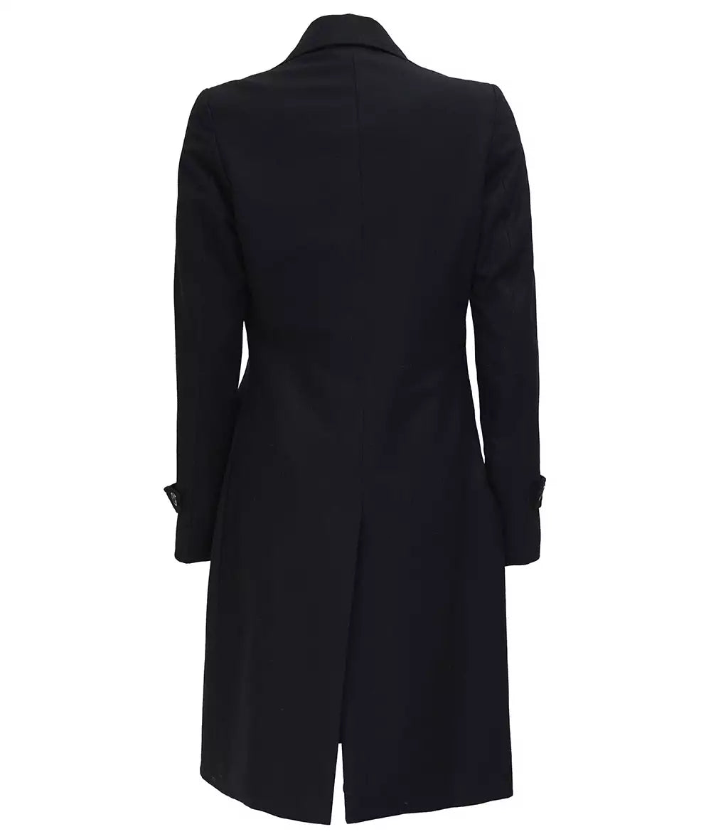 Front view of women’s black wool blazer coat with peak lapels and double-breasted closure