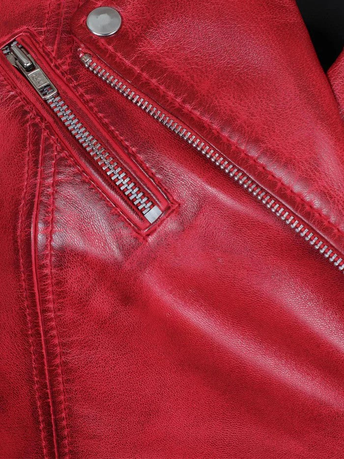 Close-up zipper pocket on women’s red biker jacket
